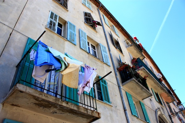 Laundry blowing from a balcony in Nice, France Laundry blowing from a balcony in Nice, France