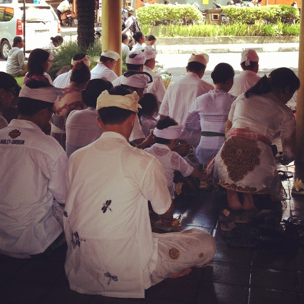 Balinese people praying at a festival, Seminyak, Bali, Indonesia Balinese people praying at a festival, Seminyak, Bali, Indonesia