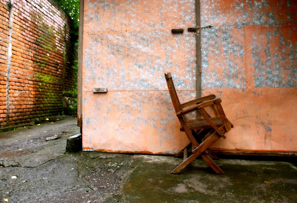Wooden Chair and wall in Umulas, Seminyak, Bali, Indonesia Wooden Chair and wall in Umulas, Seminyak, Bali, Indonesia