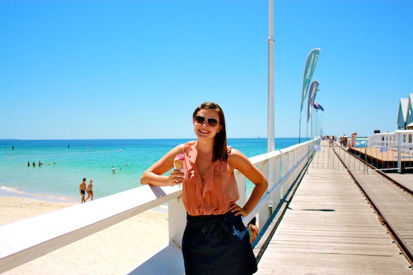 Mauve ruffled top and black skirt in Australia