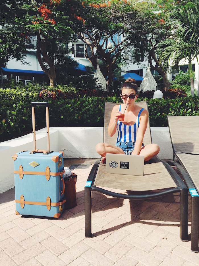 Solid and Striped swimsuit and Steamline Luggage in Aruba