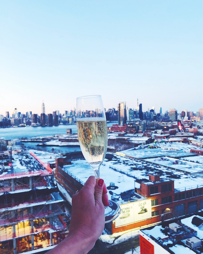 Champagne cheers from the balcony at the William Vale Hotel in Williamsburg, Brooklyn